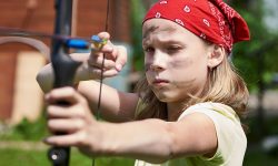 young=girl-shooting-bow-and-arrow