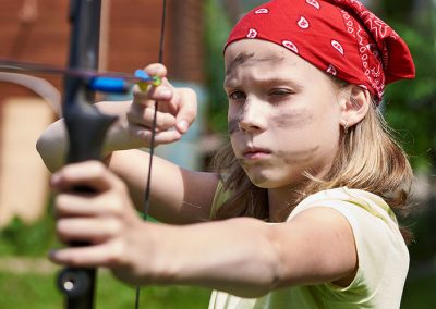 young=girl-shooting-bow-and-arrow