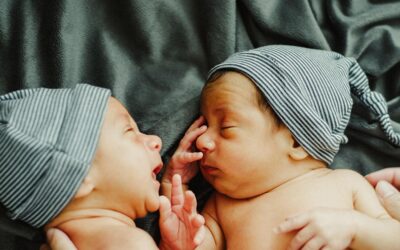 twin infants facing each other