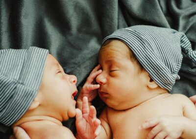 twin infants facing each other