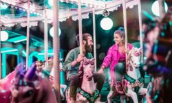 young-couple-riding-carousel