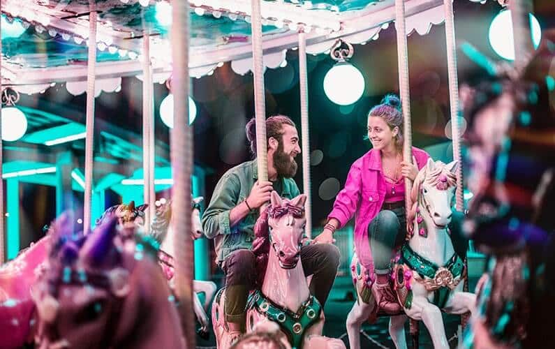 young-couple-riding-carousel
